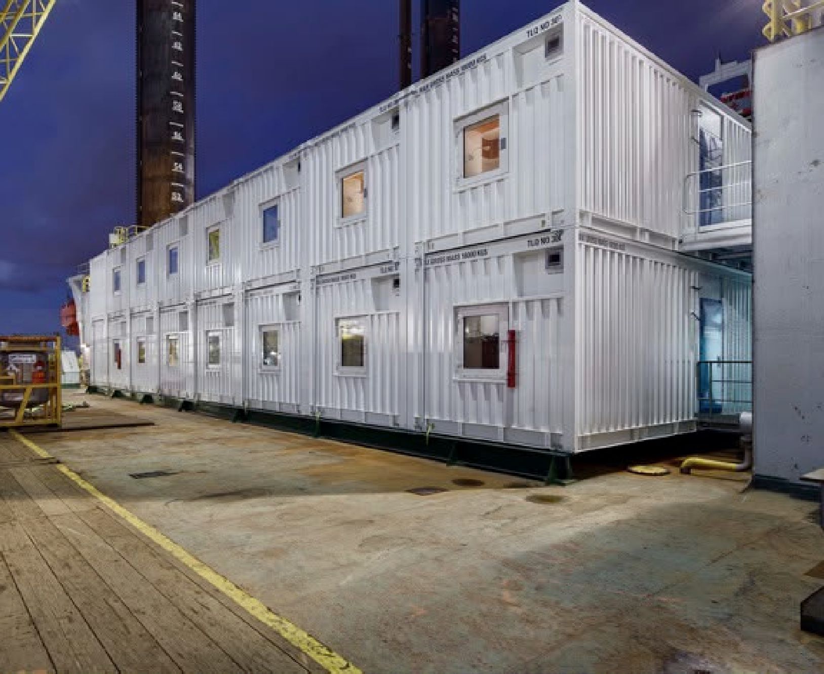 Stacked TLQ containers on a rig deck