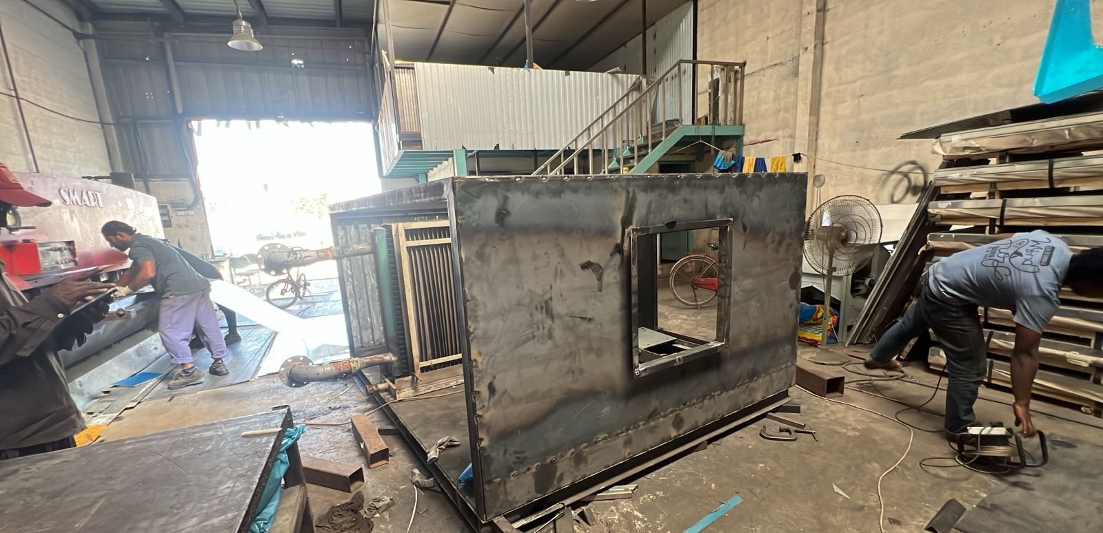 TOTS crew fabricating a steel accommodation module in the workshop