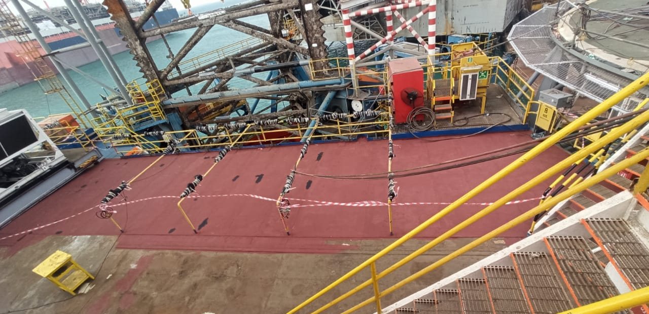 Non-skid deck coating in progress on an offshore unit