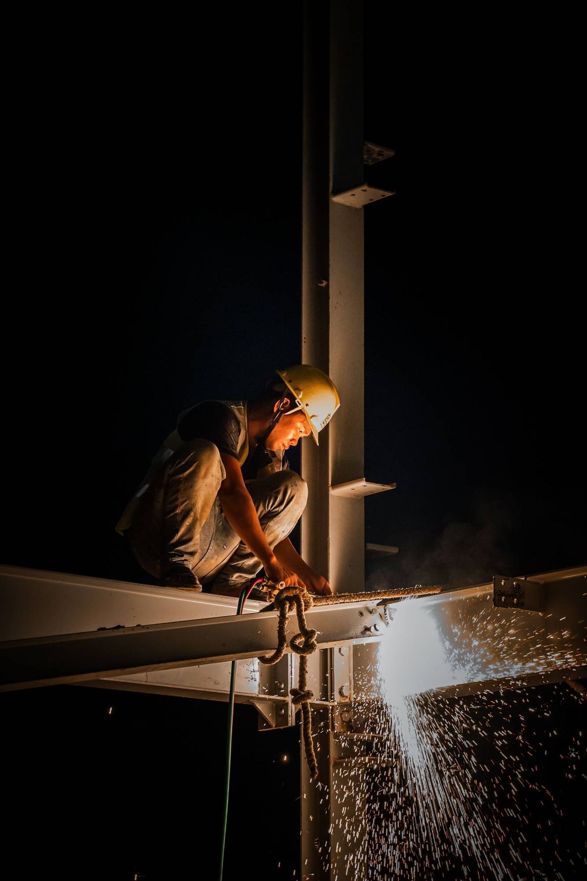 Welder cutting steel in the workshop